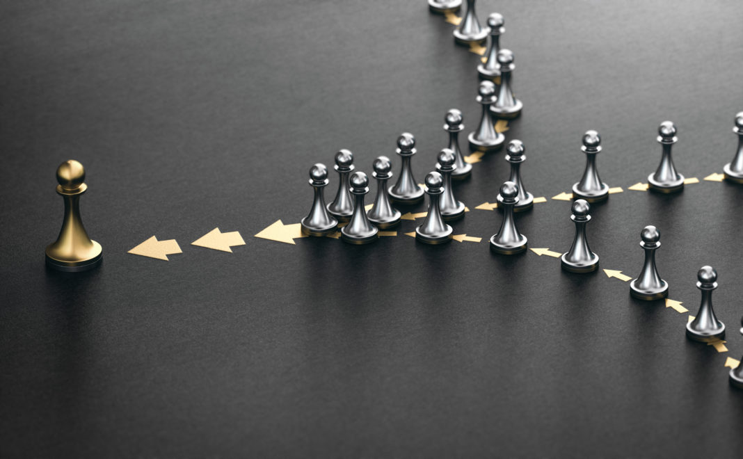 leader and followers over black background. good leadership concept.